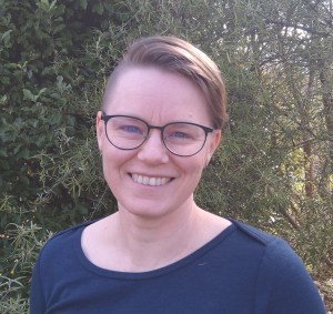 Deborah smiles at the camera.