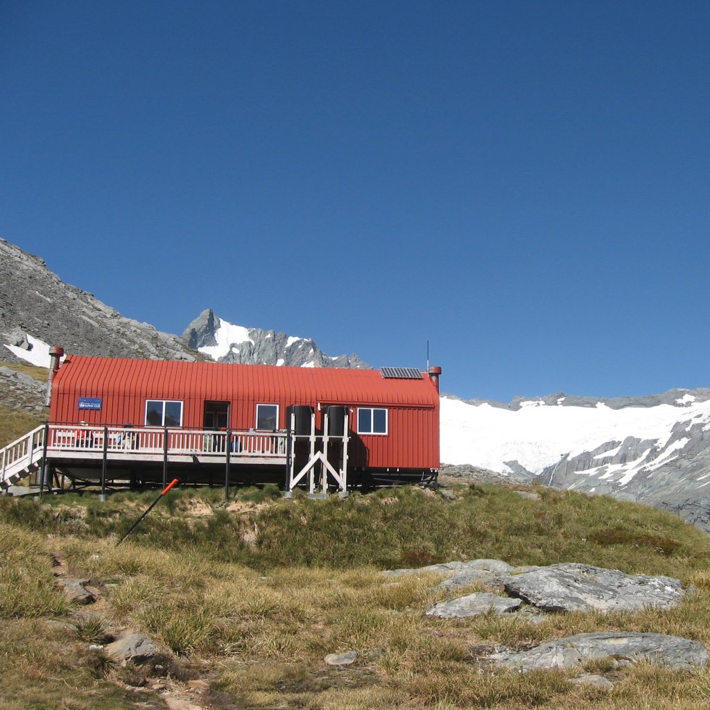 The red corrugated hut of French Ridge Hut