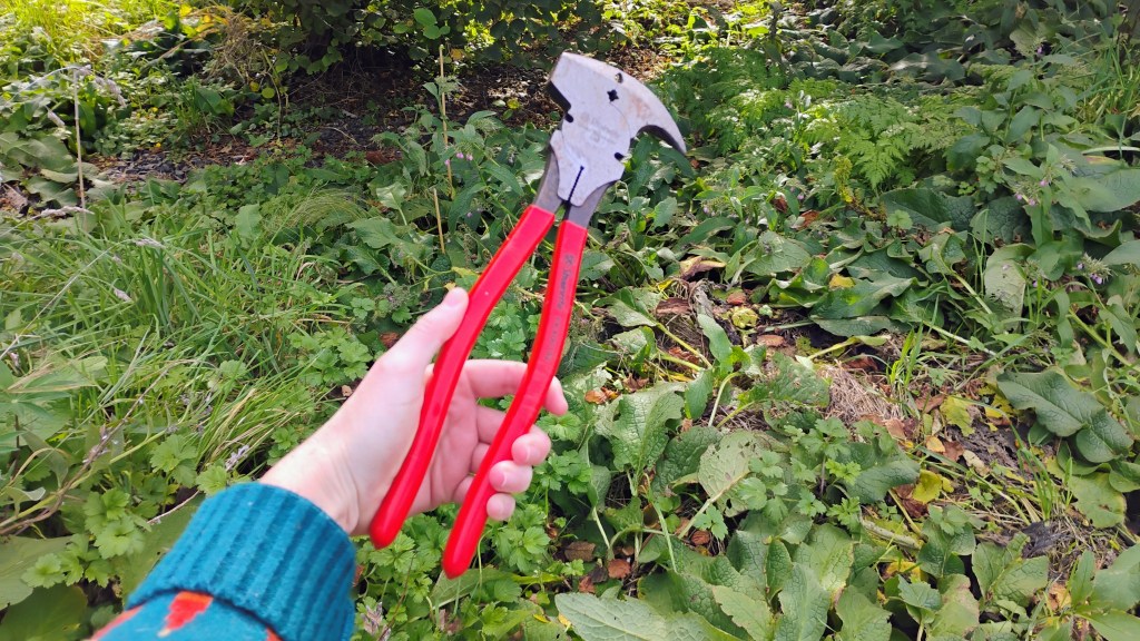 Red-handled fencing pliers